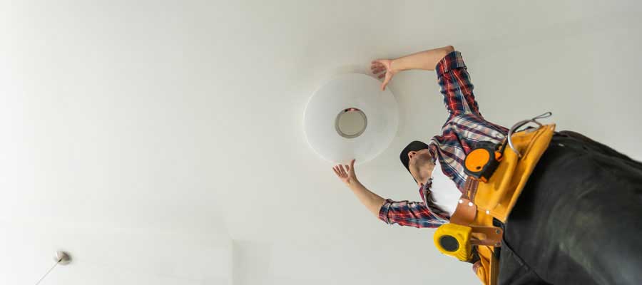 Electrician Installing Light Fixture